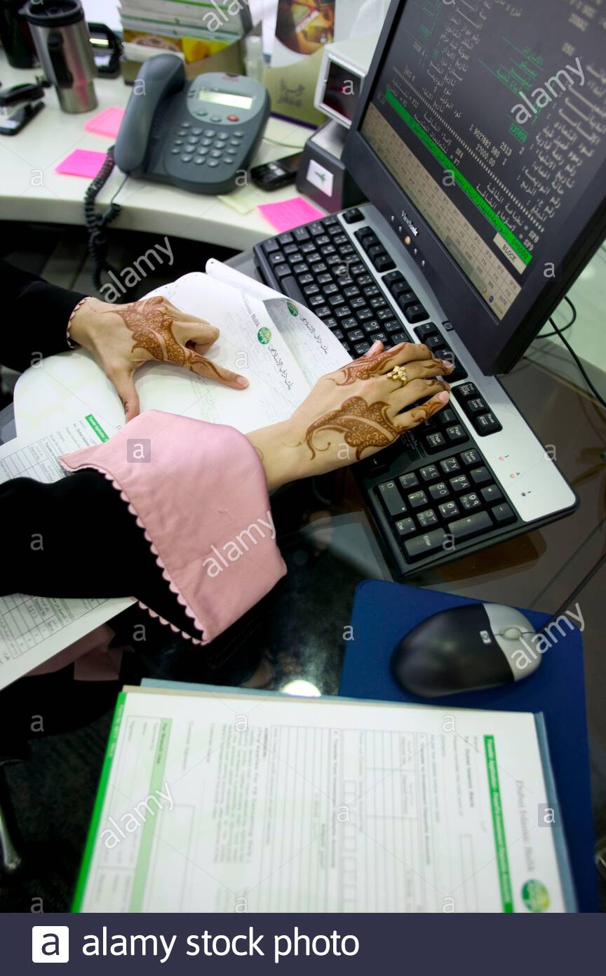Employee Working On Her Desk At The Johara Ladies Branch Of