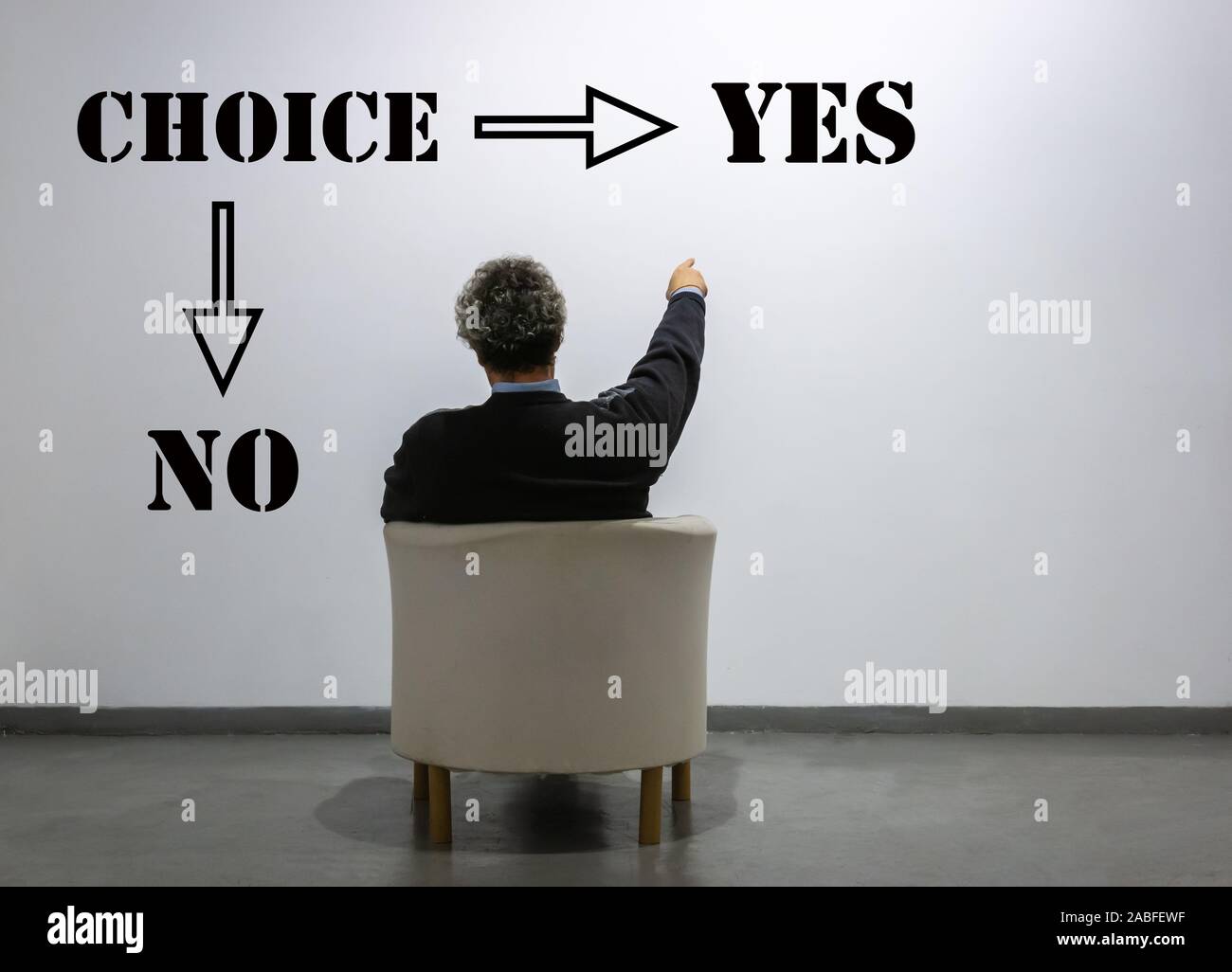a man in front of the words yes or no chooses yes - Concept of decision making. Stock Photo