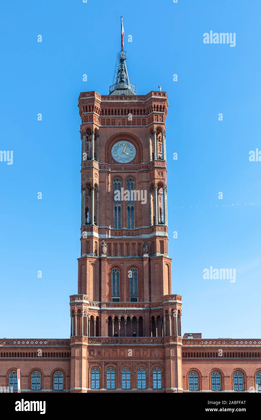 Front view of the clock tower on top of the famous Red City Hall (Rotes Rathaus) on the Alexander Square in center of Berlin, Germany Stock Photo