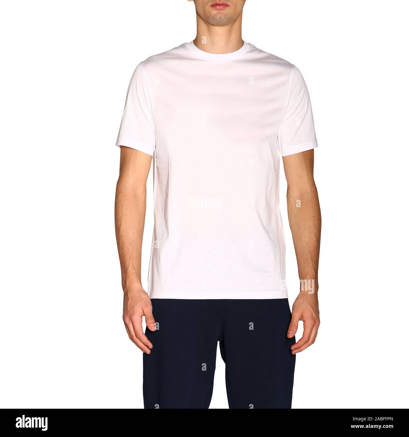 White t-shirt mock up,front view, isolated on white background. Male model wear plain white shirt mock-up and black pant.white shirt design template. Stock Photo
