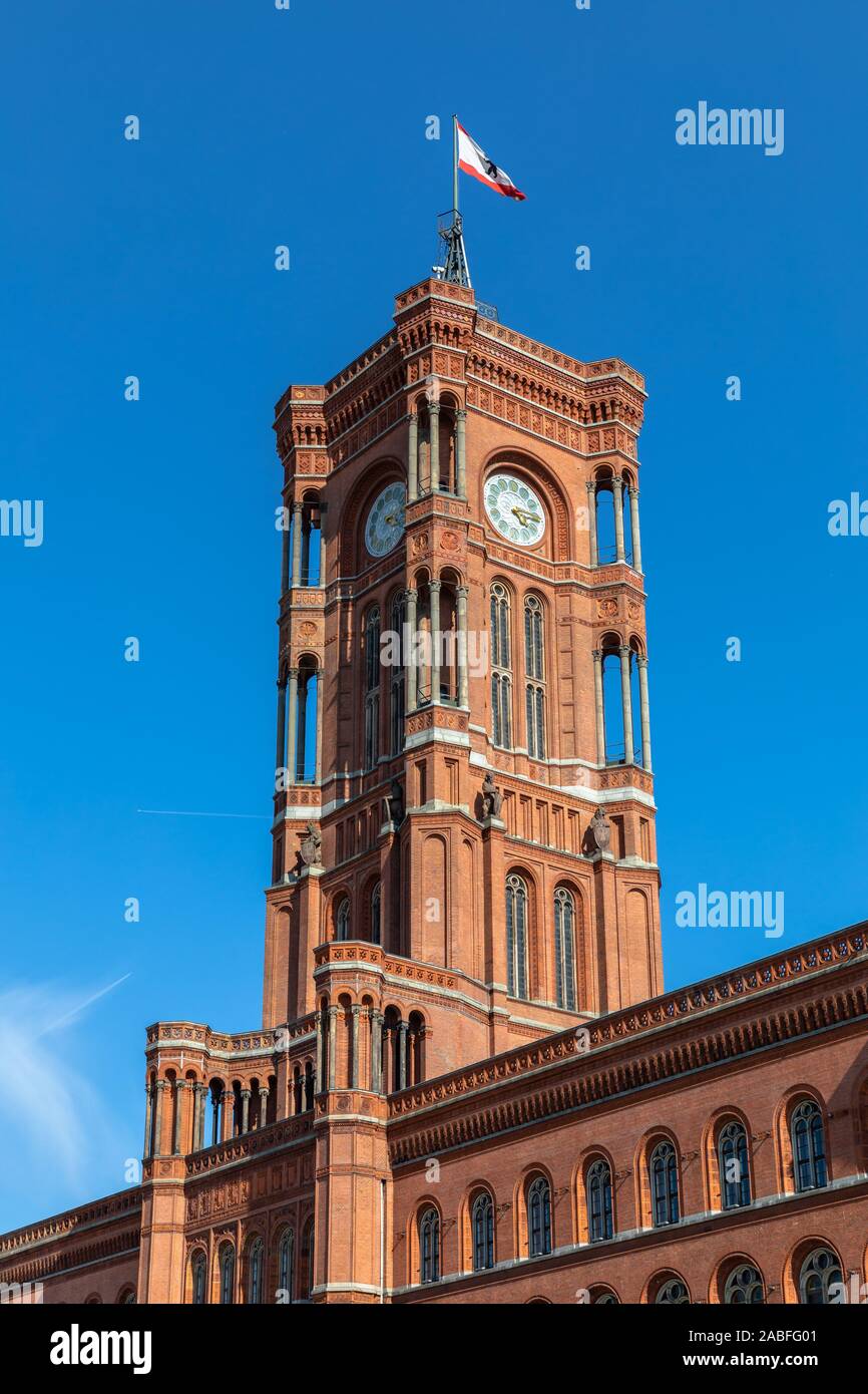 Close view of the clock tower on top of the famous Red City Hall (Rotes Rathaus) on the Alexander Square in center of Berlin, Germany Stock Photo