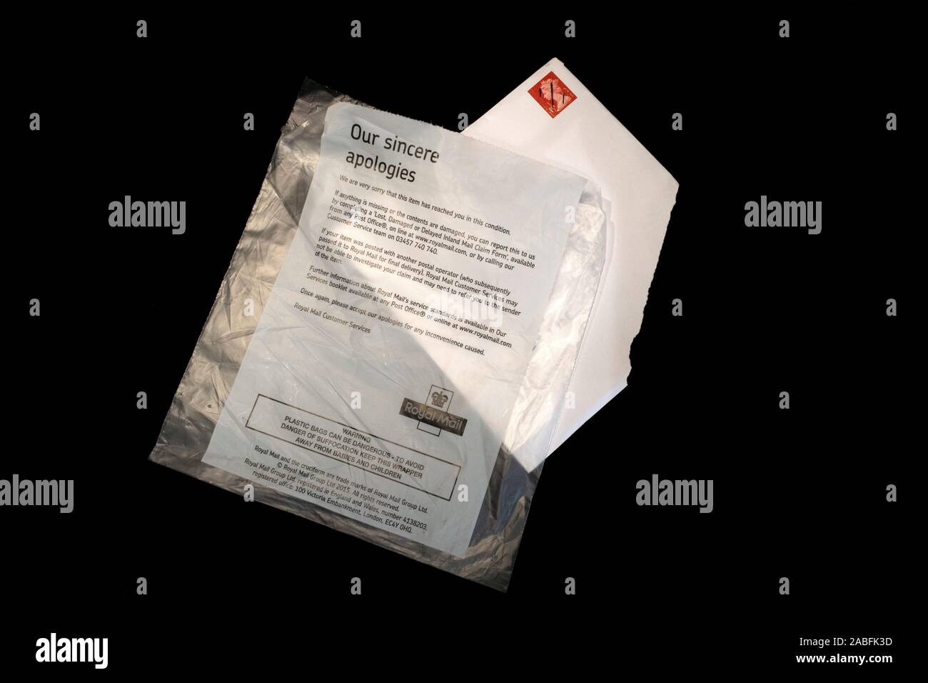 Royal Mail apology letter from the post office service. Letter, birthday card, damaged in transit by the Royal mail. Stock Photo