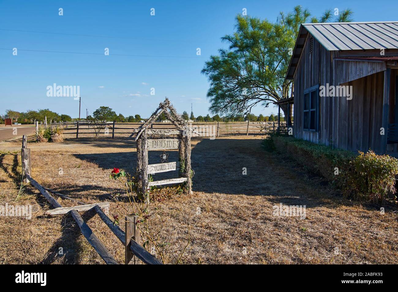 A decorative House name sign made in wood on the premises of an old wooden house in the Texas town of Round Top. Stock Photo