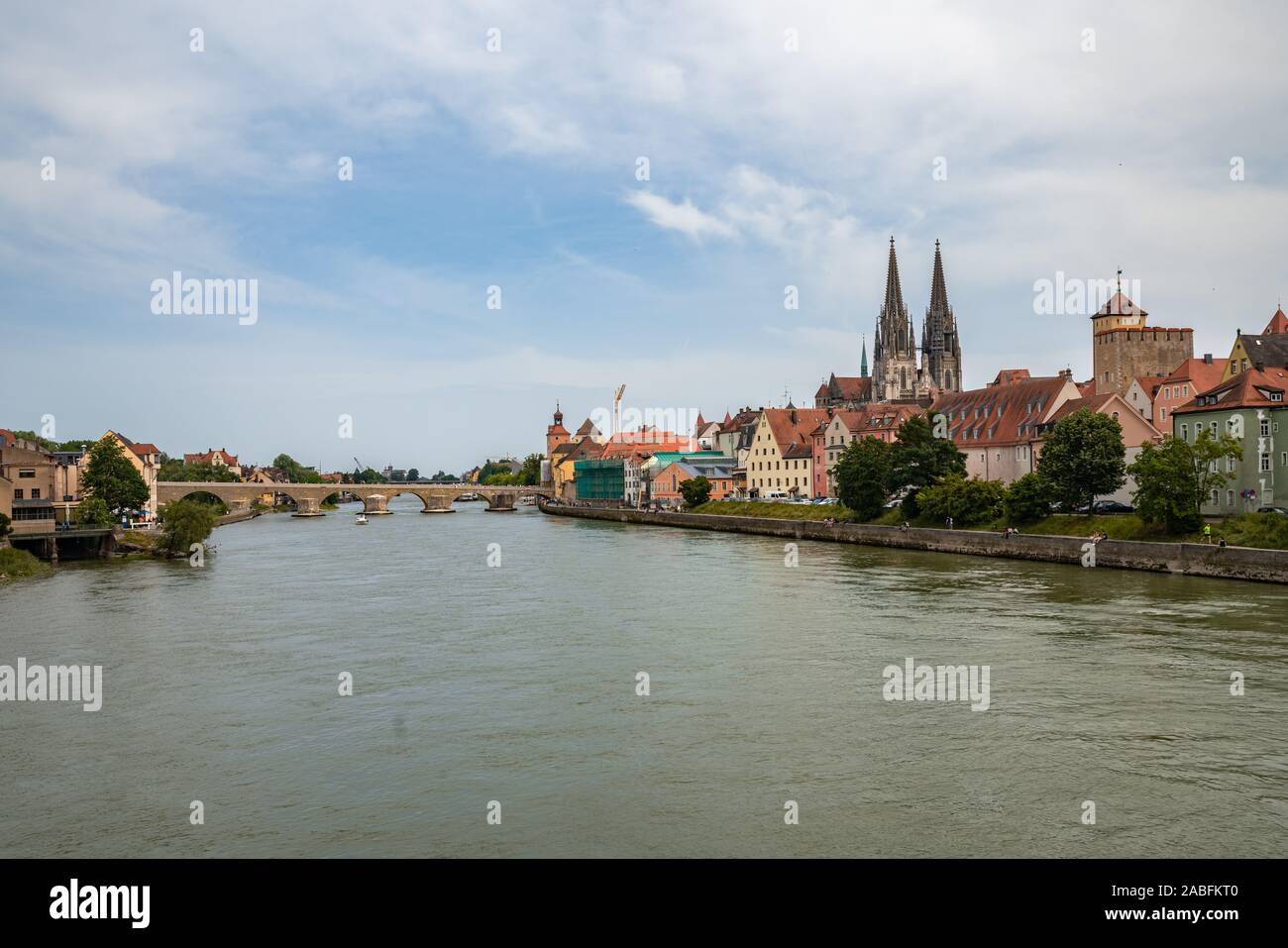 Panorama view of the stone bridge and historical old town with the St. peter cathedral of Regensburg or Ratisbon on the river side of Danube, Bavaria, Stock Photo
