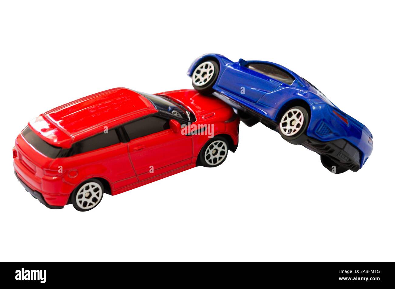 Red and blue toy cars collide on the white background. Stock Photo
