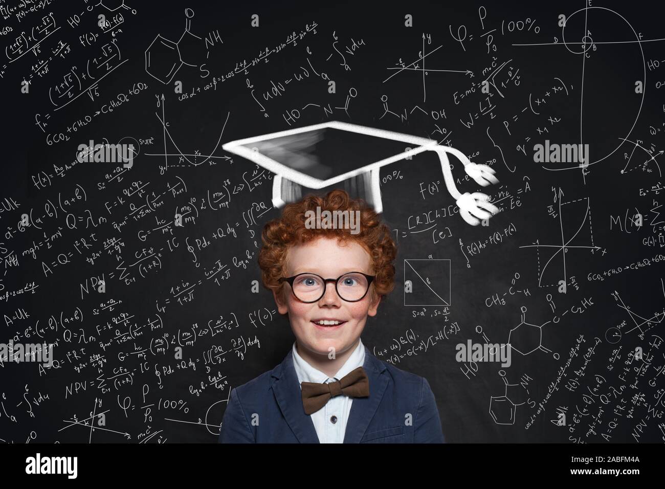 Happy kid wearing graduation hat, glasses and student uniform on science background Stock Photo