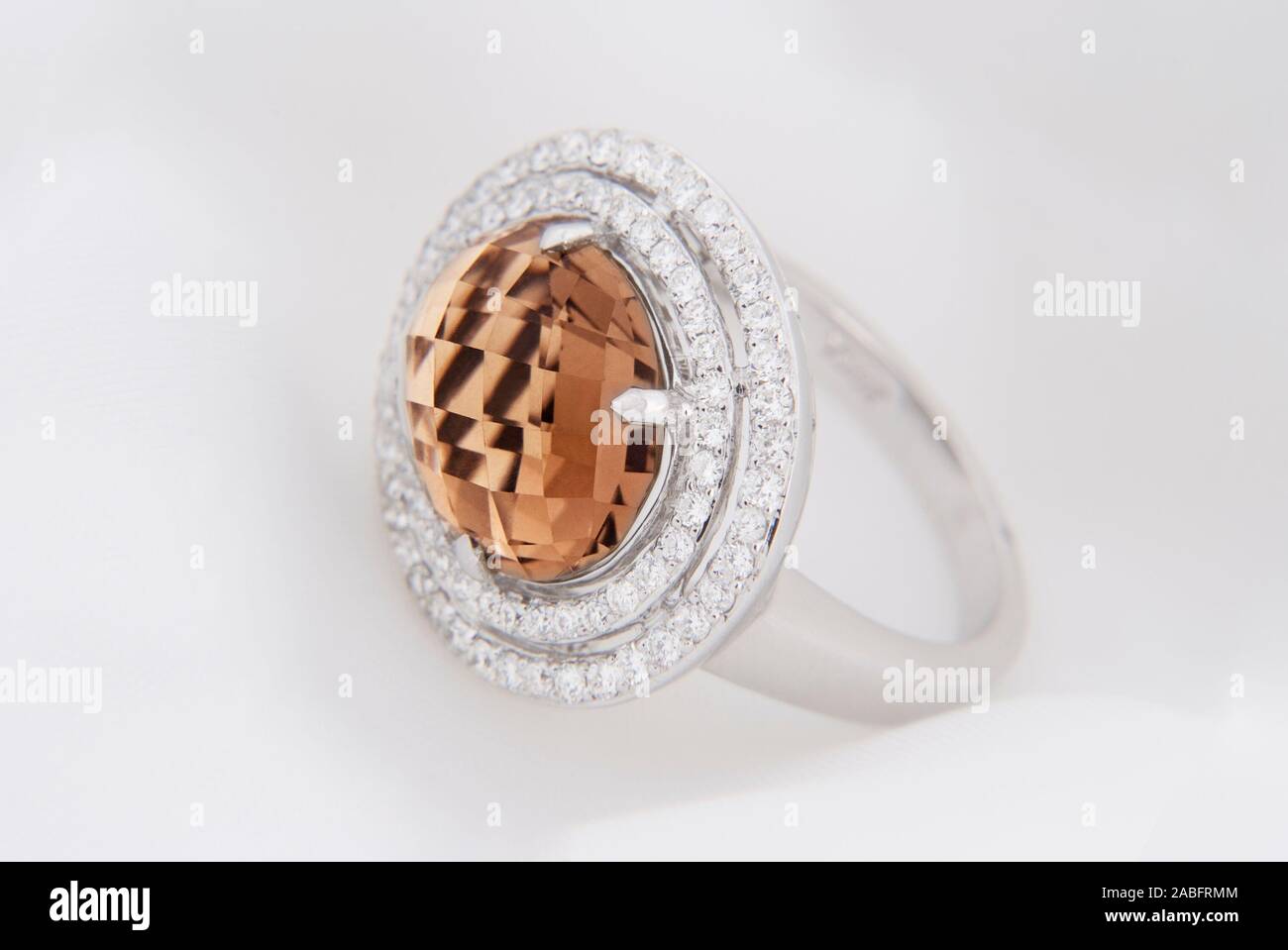 White Gold Ring With Smokey Topaz And Diamonds On Soft White Background Stock Photo