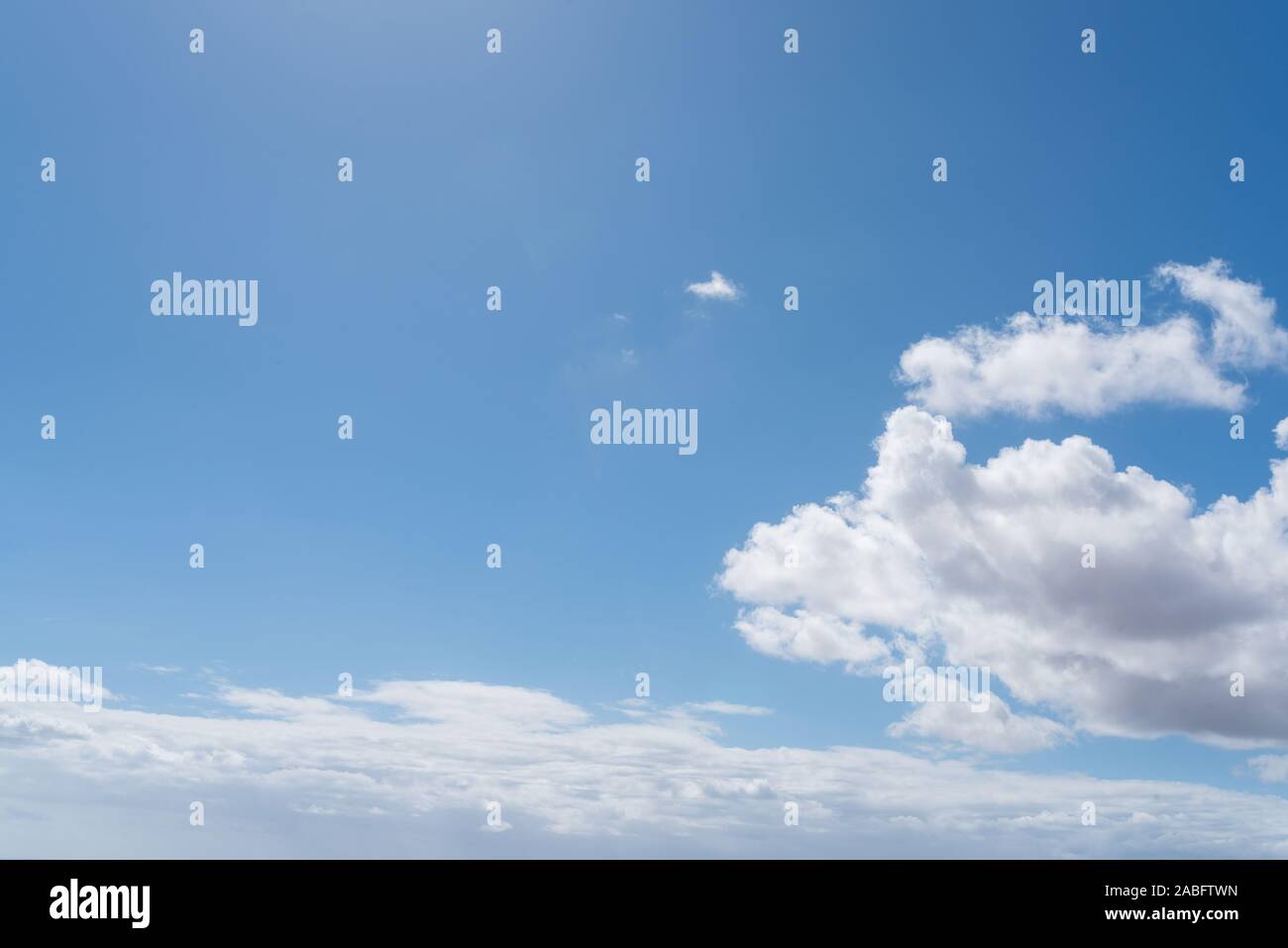 beautiful blue sky with white clouds on sunny day background Stock Photo