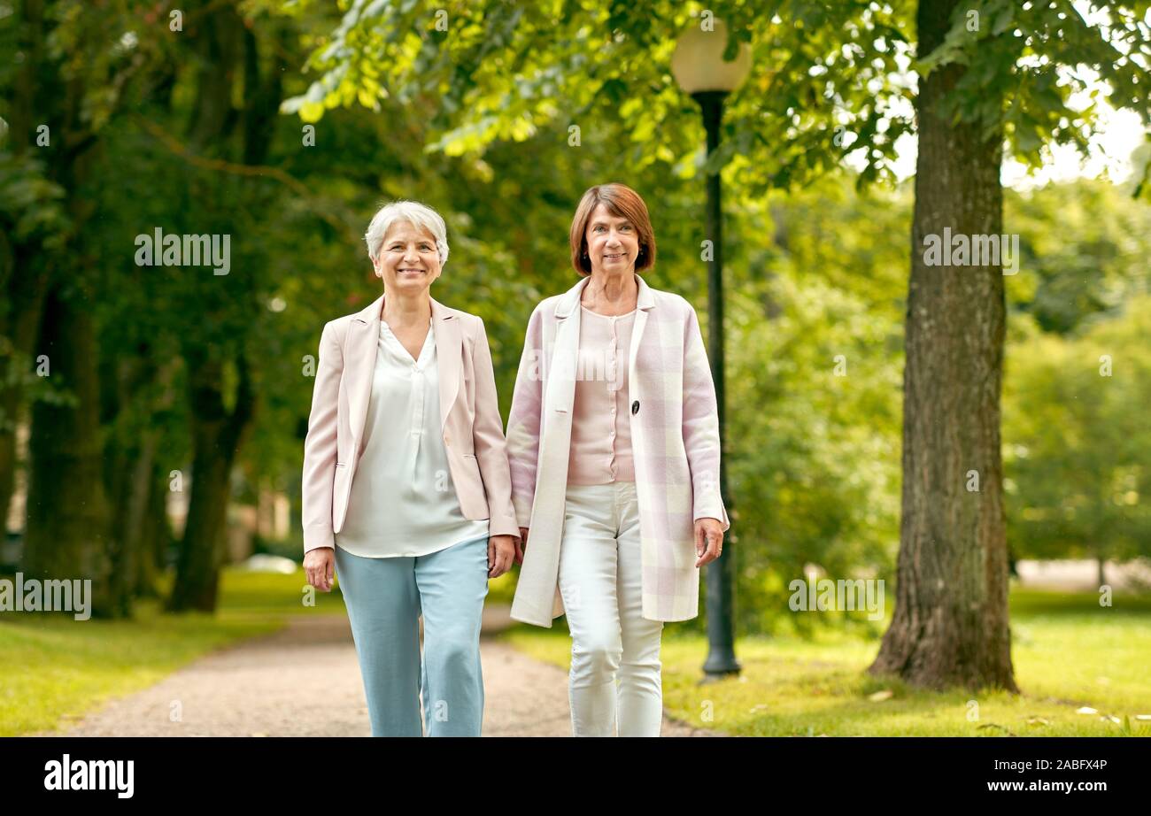 Two mature women friends walking hi-res stock photography and images ...