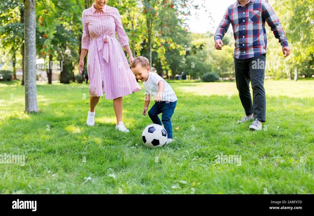 happy family playing soccer at summer park Stock Photo - Alamy