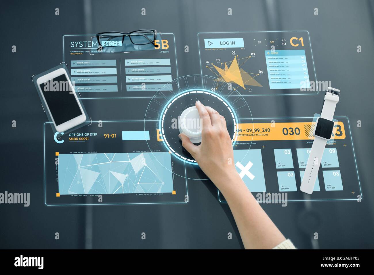 hand with control knob on interactive panel Stock Photo