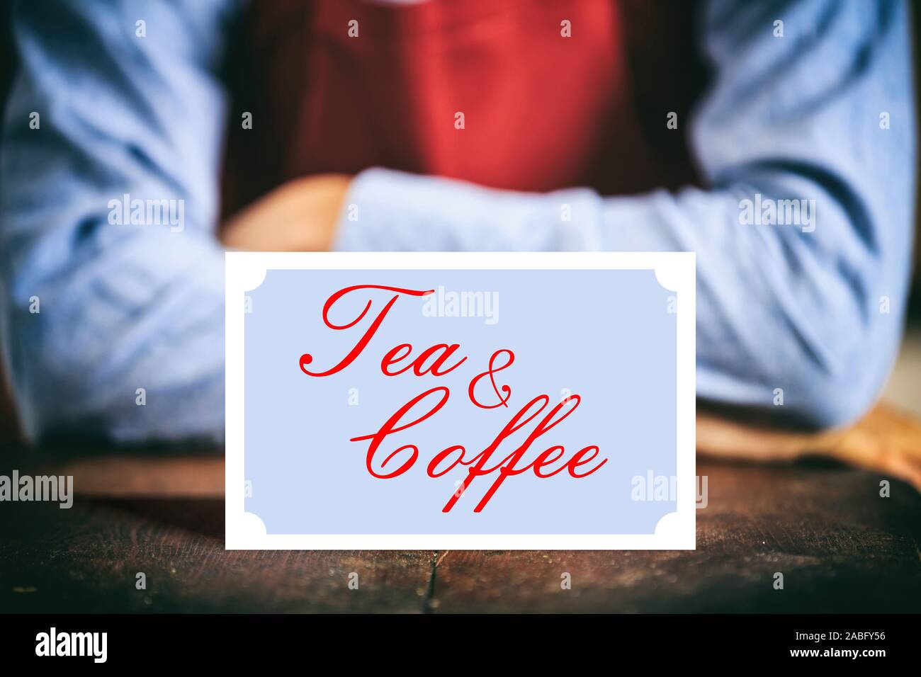 Tea and coffee. Tea & coffee text card sign, blur cafe waiter background. Stock Photo