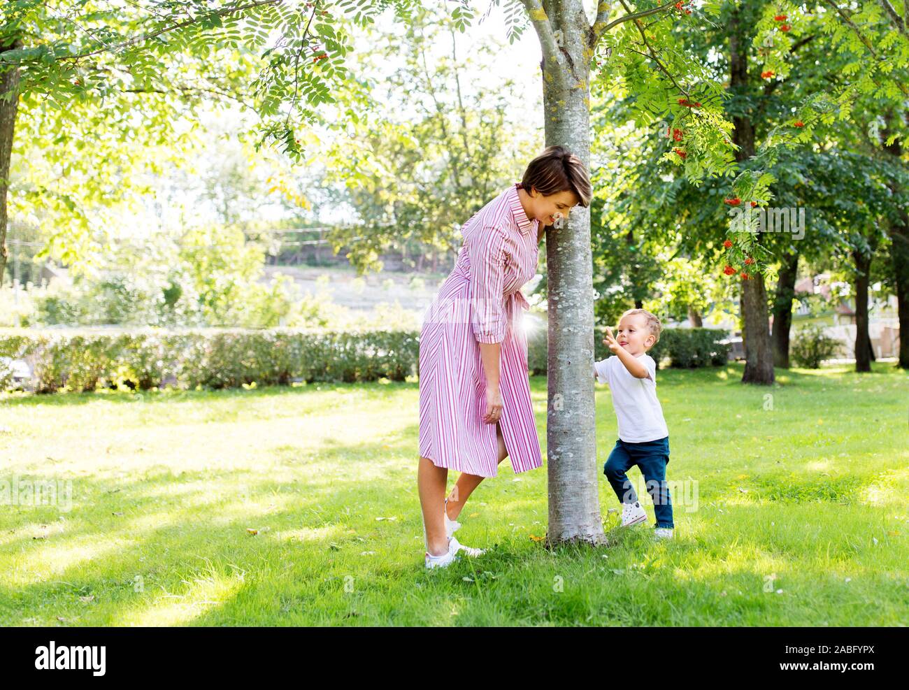 happy mother and son having fun in summer park Stock Photo