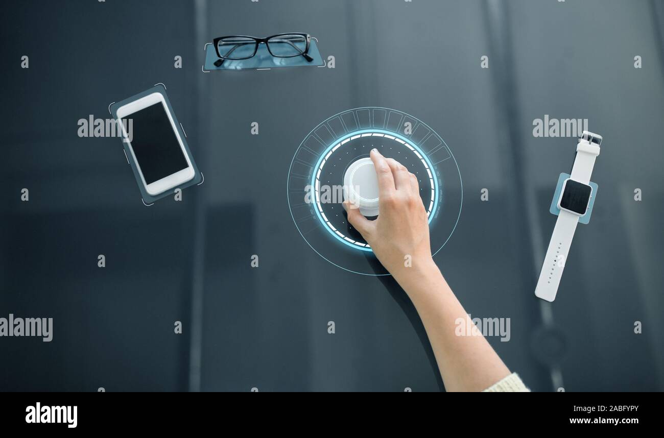 hand with control knob on interactive panel Stock Photo