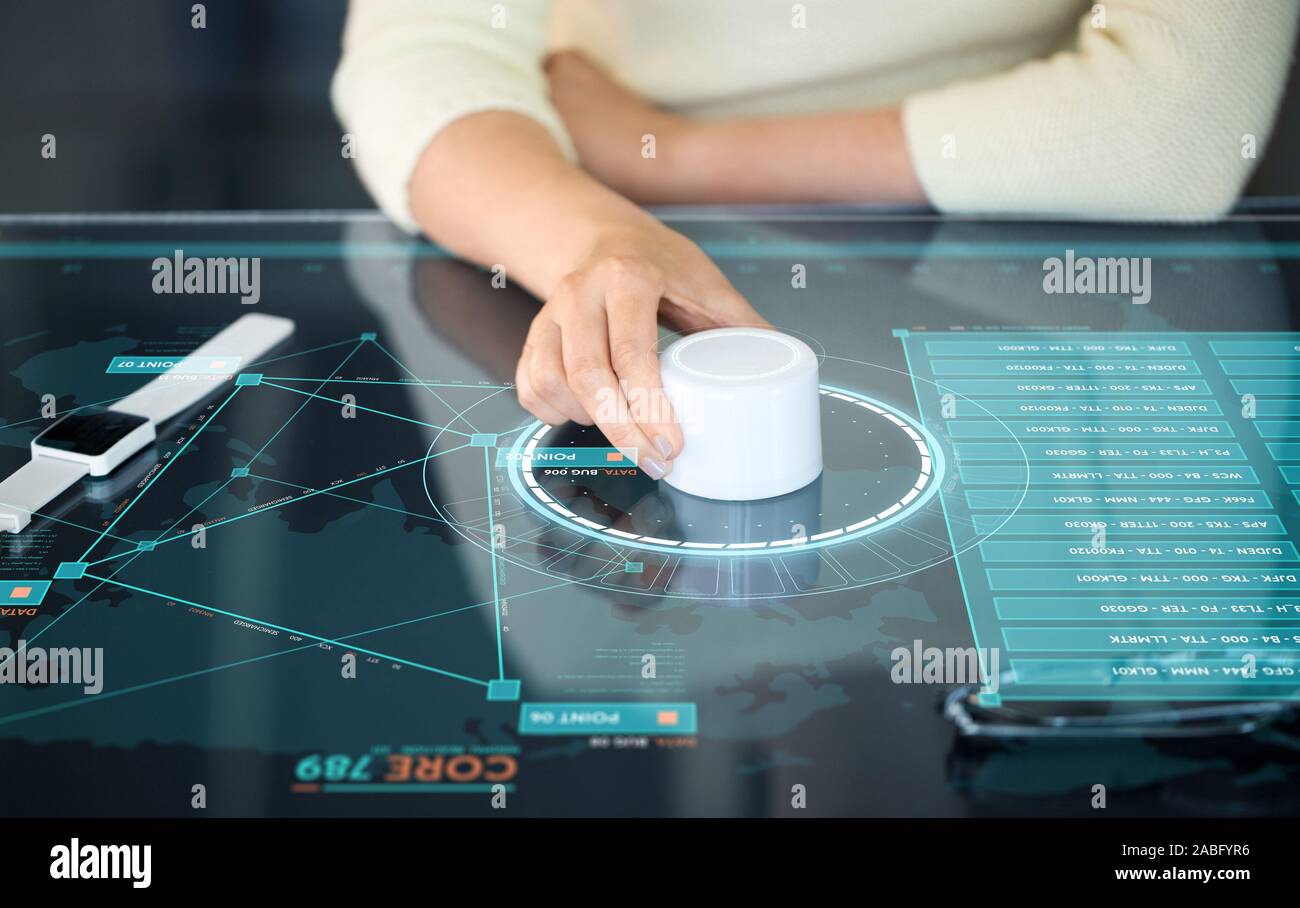 woman with control knob on interactive panel Stock Photo