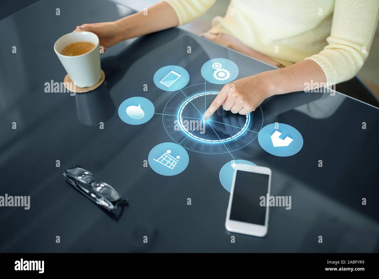 woman with coffee using black interactive panel Stock Photo
