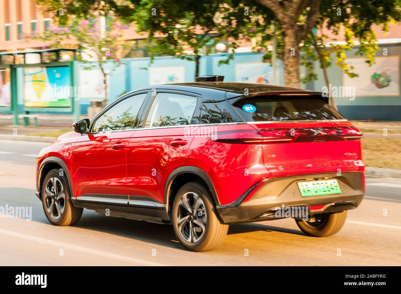An Xpeng G3, from a Chinese EV startup, driving by in Guangzhou. Stock Photo