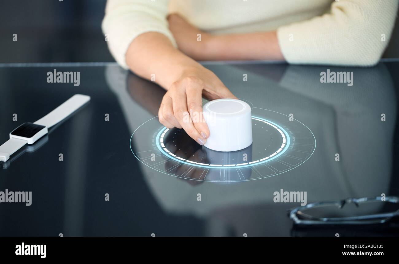 woman with control knob on interactive panel Stock Photo