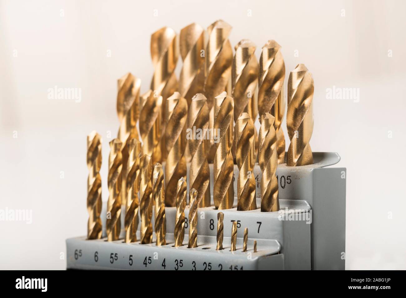 Metric sized Titanium coated drill bits in an index Stock Photo Alamy
