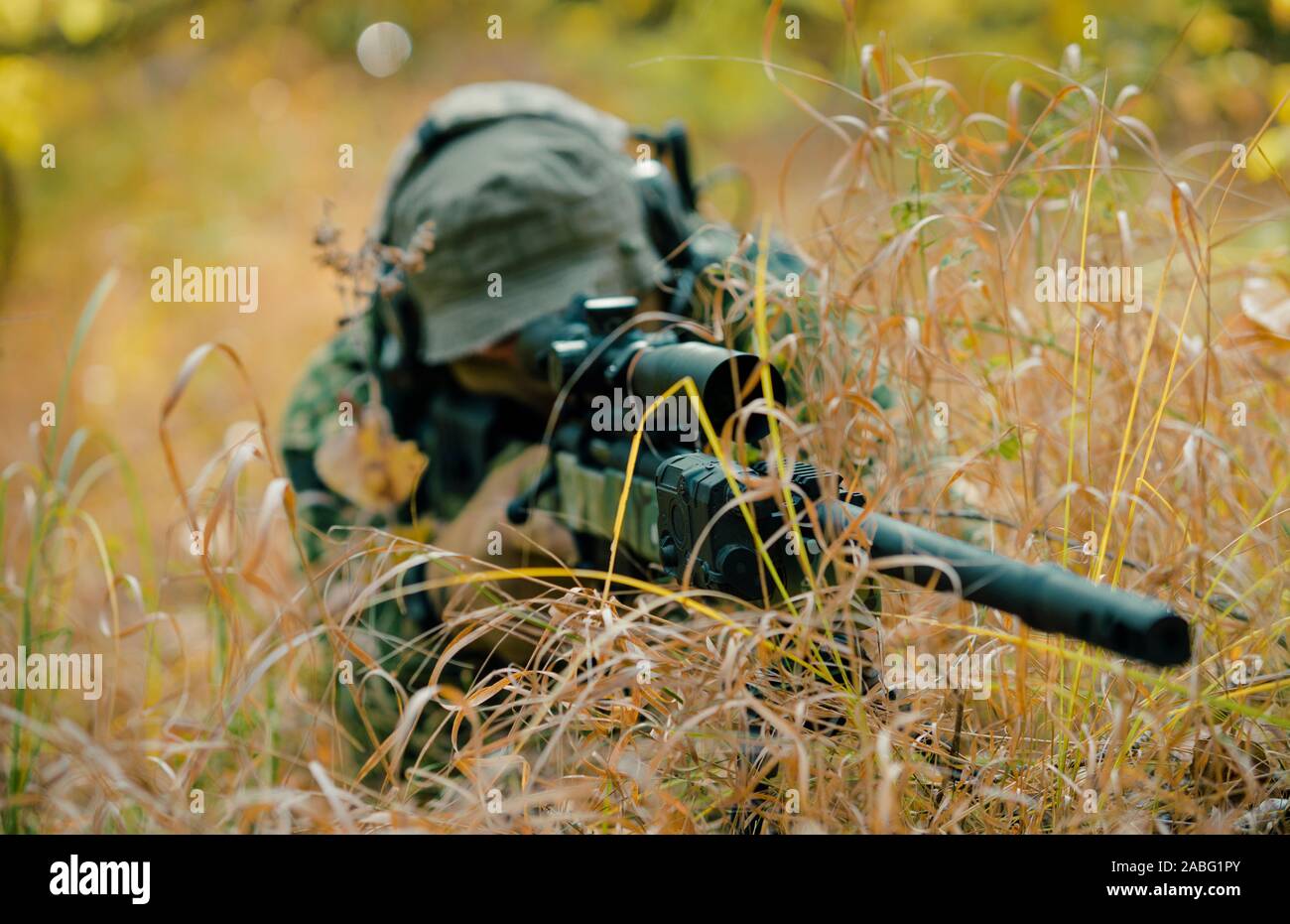 camouflaged sniper rifle with scope Stock Photo - Alamy