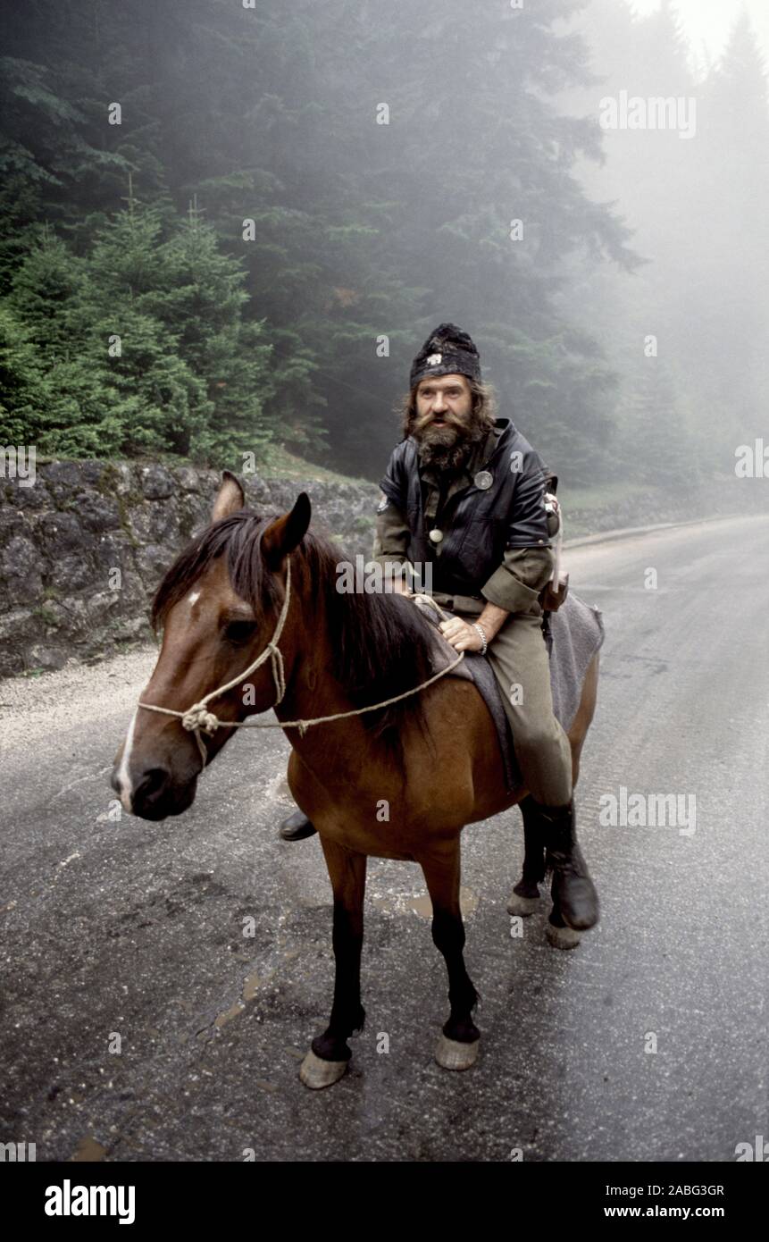 8th August 1993 During the war in Bosnia: a bearded Bosnian-Serb soldier sits astride his horse on Mount Trebevic, on the road between Pale and Sarajevo. Stock Photo