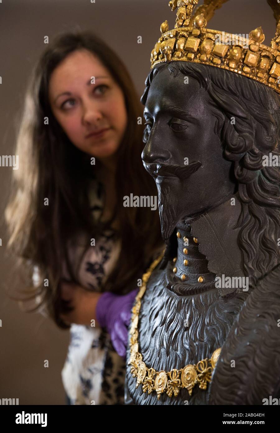 Portia Tremlett, Public Programme Engagement officer for the Novium Museum, looks at the original Market Cross sculpture, a bust of King Charles I by Hubert Le Sueur, as it returns to it's original home in Chichester, where it will go on display at the Novium Museum on loan from Tate Britain. Stock Photo