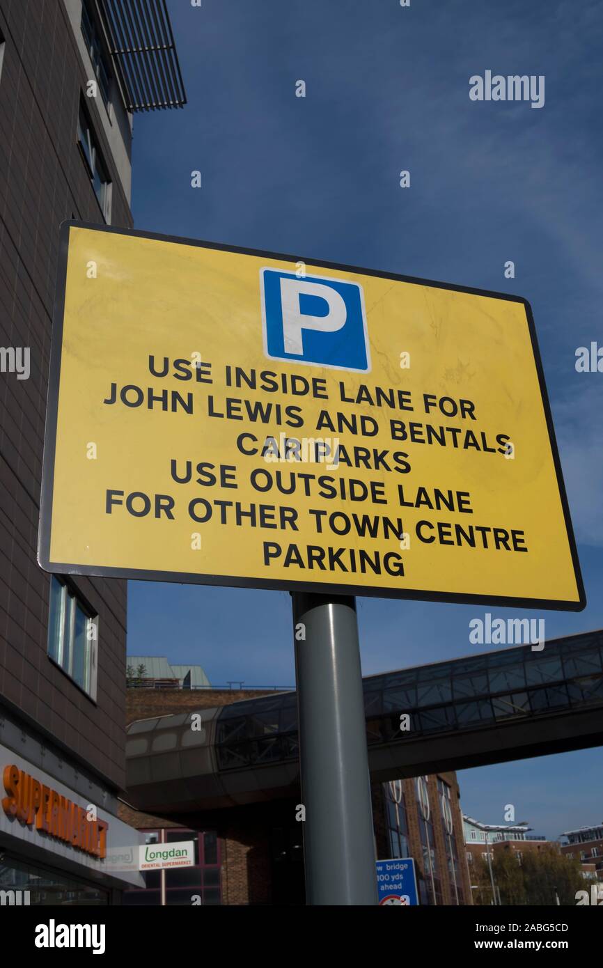 road sign in kingston, surrey, england, indicating lane use for local shopping parking with misspelling of bentalls as bentals Stock Photo