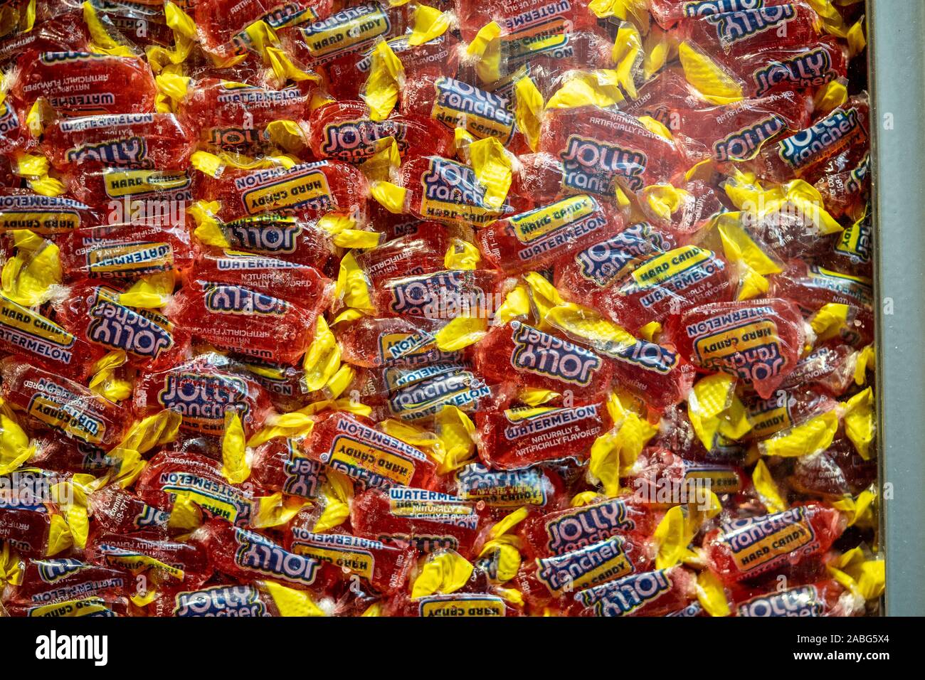 Hershey, PA / USA - November 26, 2019:  Foil wrapped Hershey’s Jolly Rancher Watermelon Hard Candy on display in Chocolate World. Stock Photo