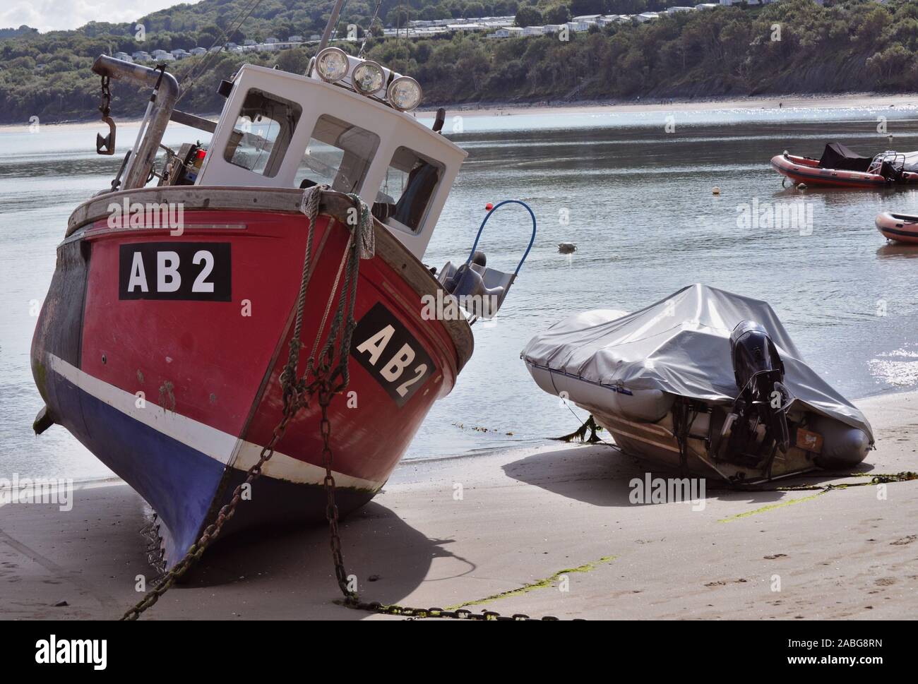 New Quay Ceredigion/UK September 02 2017: Fishing boat out of the water and listing on the sand at low tide. Stock Photo
