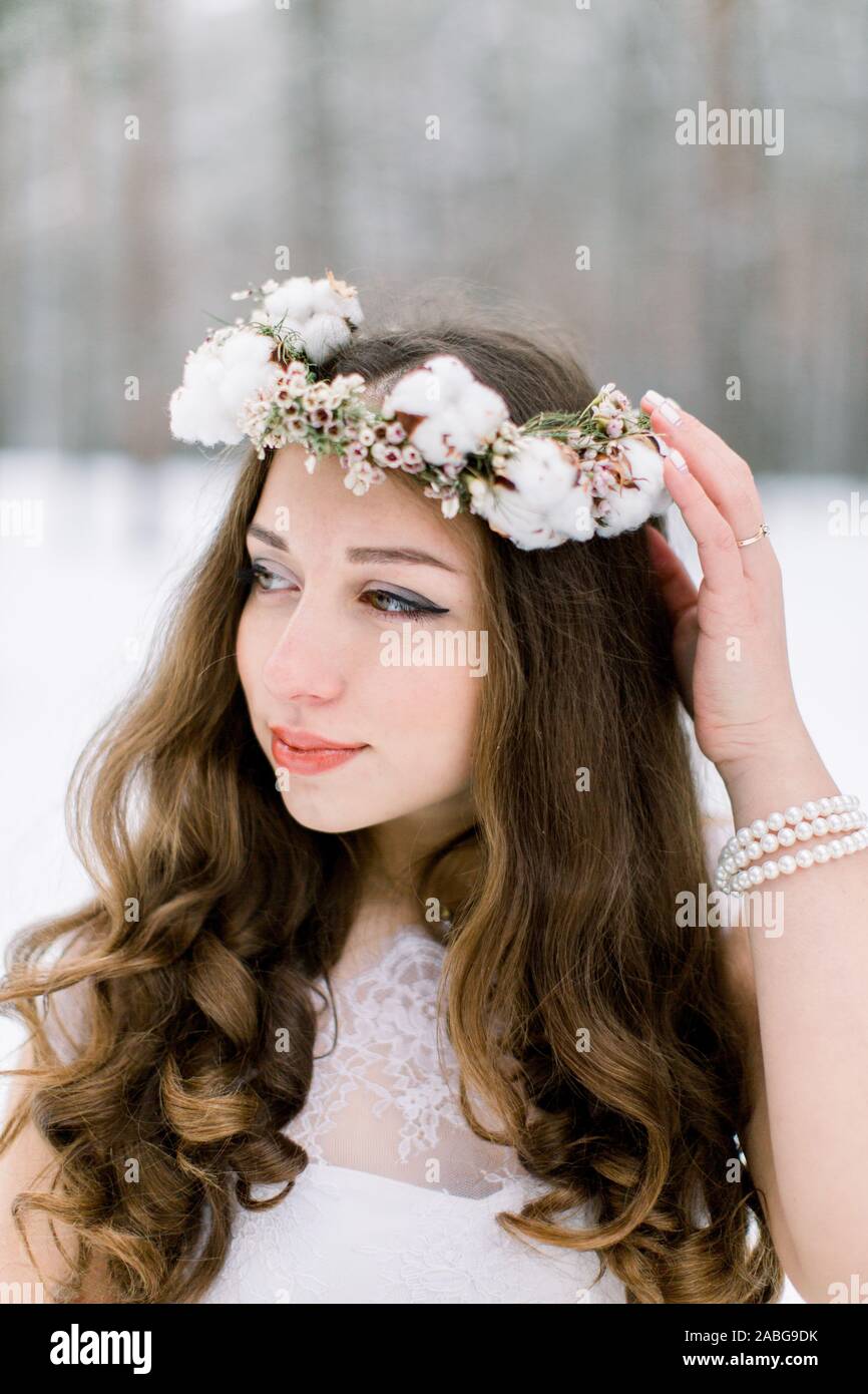 Cold tones portrait of beauty woman with wreath on head and cute
