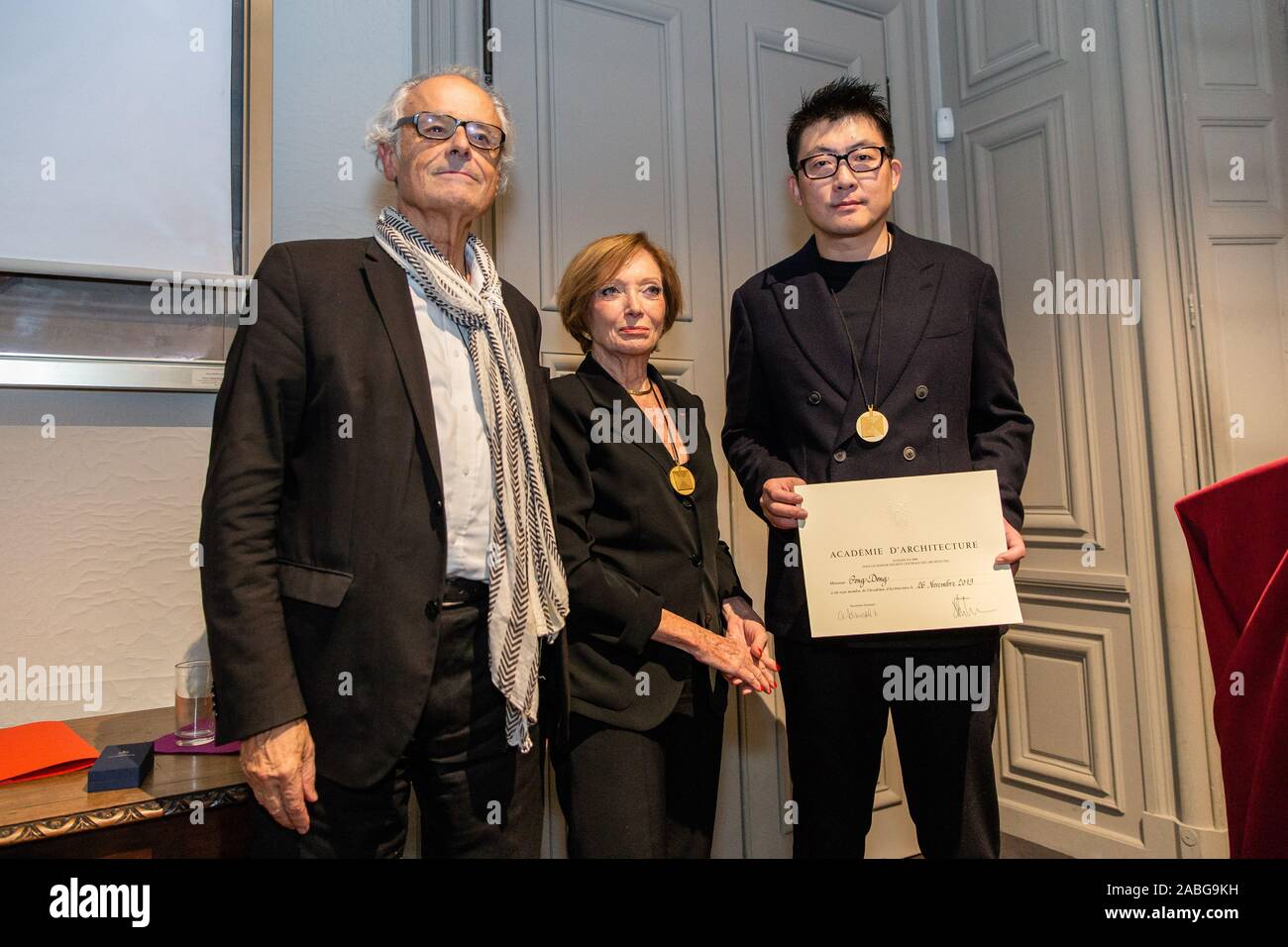 Paris, France. 26th Nov, 2019. Dong Gong is presented the certificate at the installation ceremony in Paris, France, Nov. 26, 2019. Chinese architect Dong Gong has formally become a foreign member of the French Academy of Architecture. Credit: Aurelien Morissard/Xinhua/Alamy Live News Stock Photo