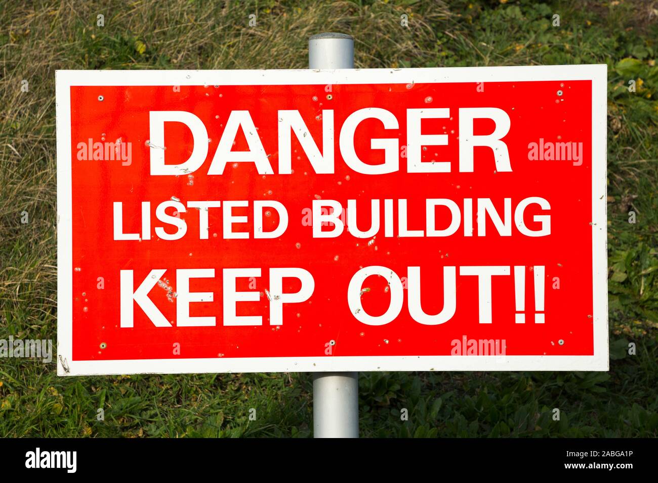 Listed building keep out sign, and danger signs at a former MOD / Ministry of Defence army or navy / naval site. UK (105) Stock Photo