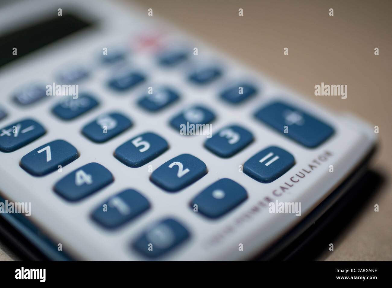 calculator with blue keys on white background Stock Photo