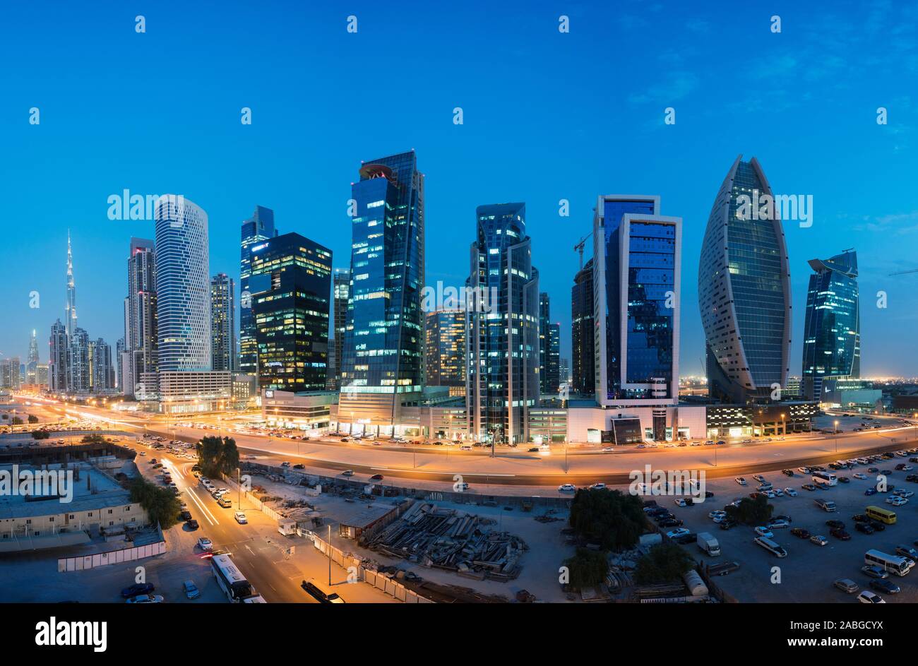 Skyline of new office towers at night  in Business Bay district of Dubai United Arab Emirates Stock Photo