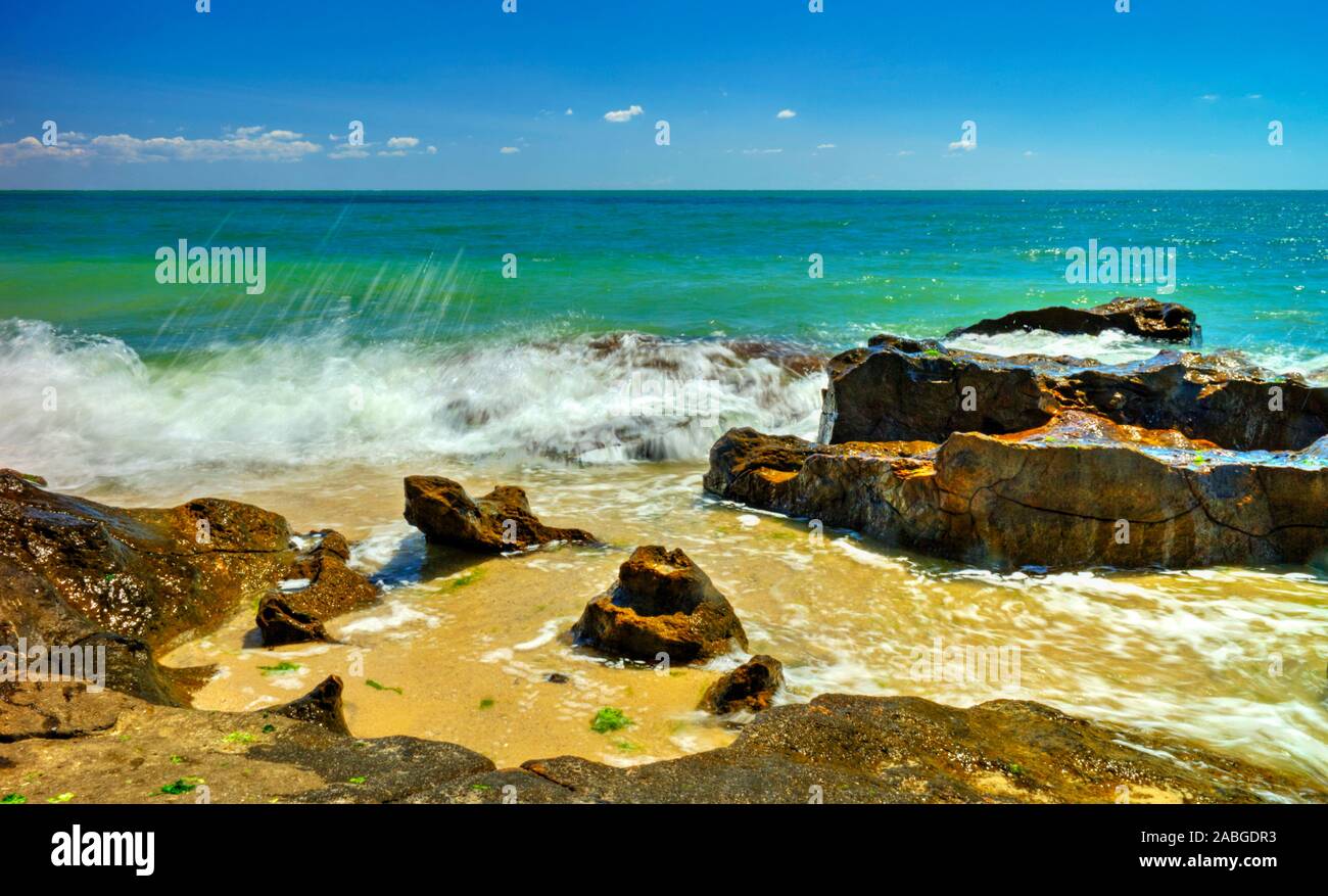 Beautiful landscape with rocks and sea waves on a sunny beach Stock ...