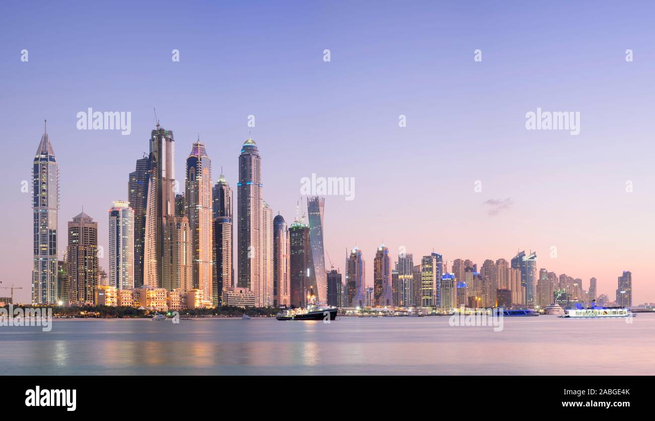 Skyline of skyscrapers at dusk  at Marina district in Dubai United Arab Emirates Stock Photo