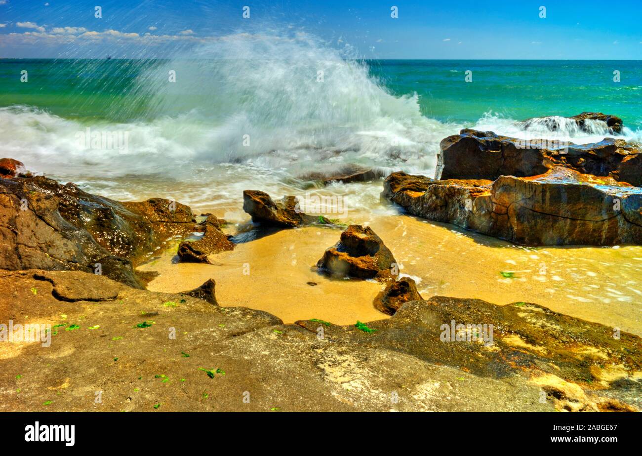 Beautiful landscape with rocks and sea waves on a sunny beach Stock ...