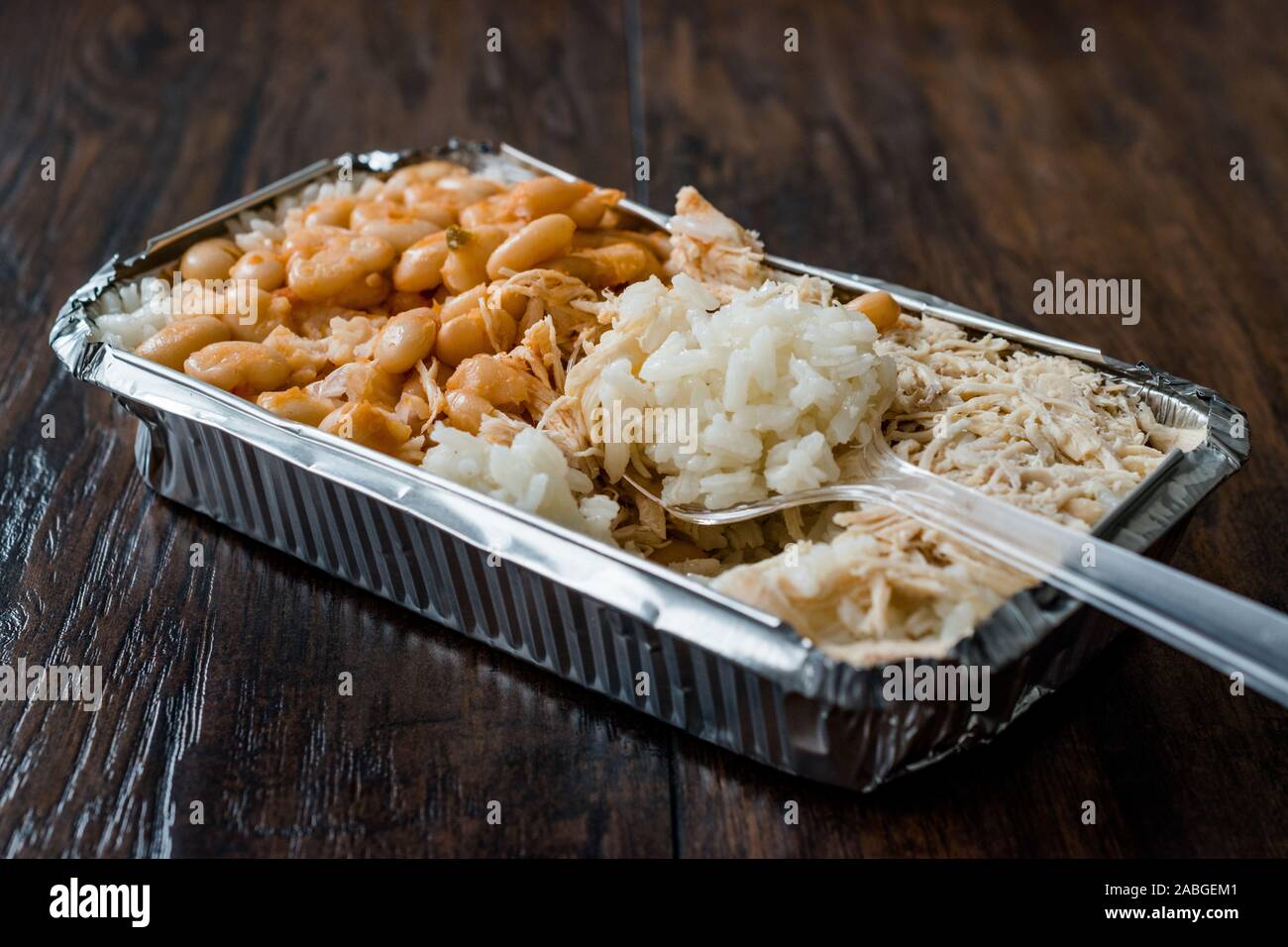Take Away Turkish Fast Food Chicken, Rice and Baked Beans / Tavuk Pilav or Pilaf in Plastic Box Package / Container. Traditional Dish. Stock Photo