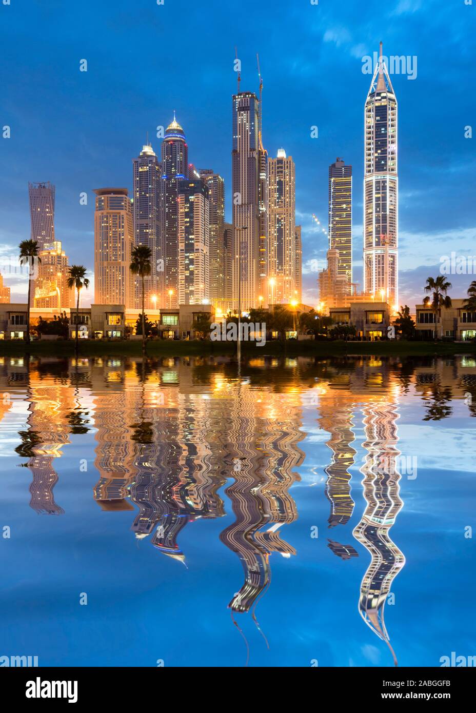 Futuristic skyline at night of new skyscrapers in Marina district of Dubai United Arab Emirates Stock Photo