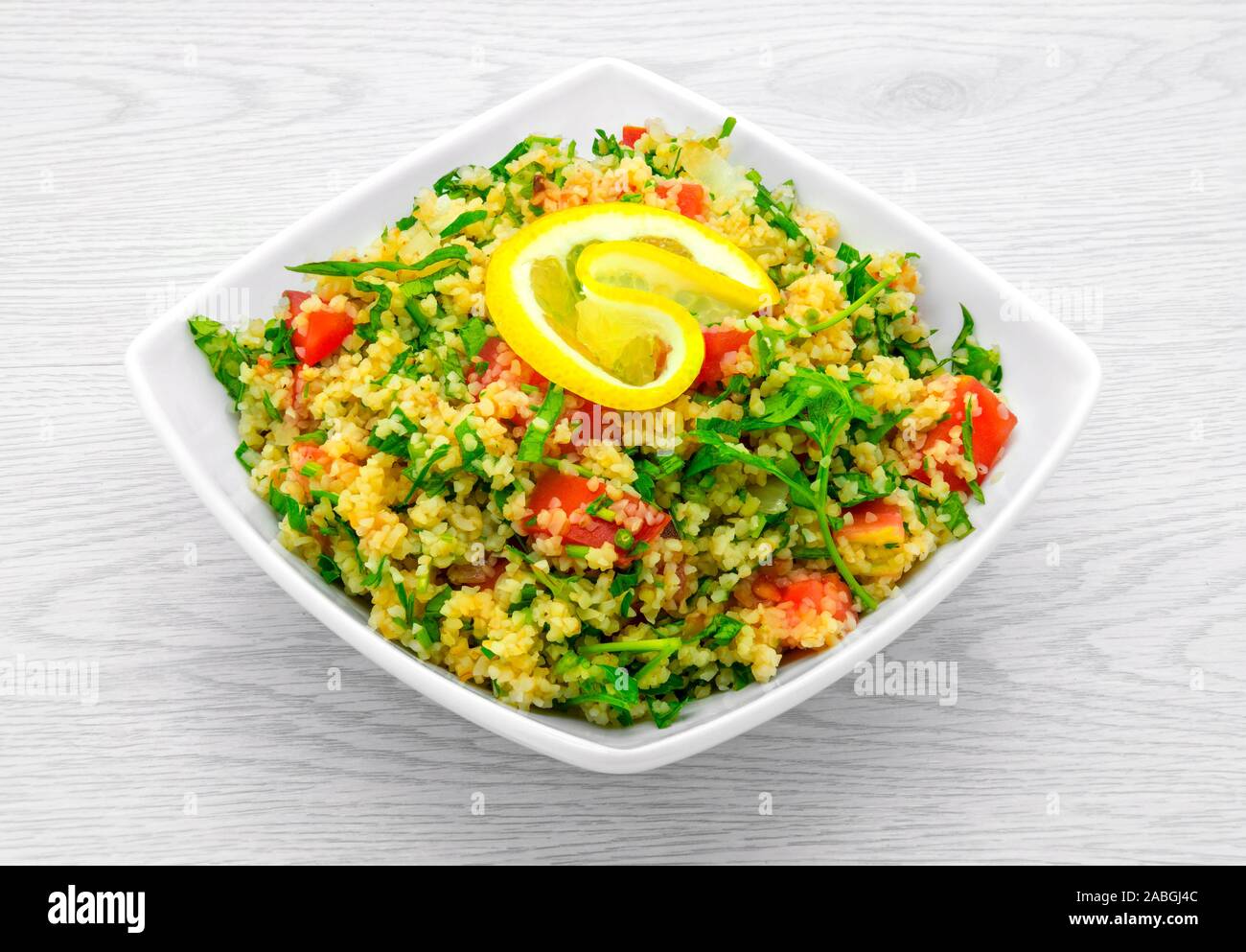 Dietary and fresh burgul salad on a light background. Stock Photo