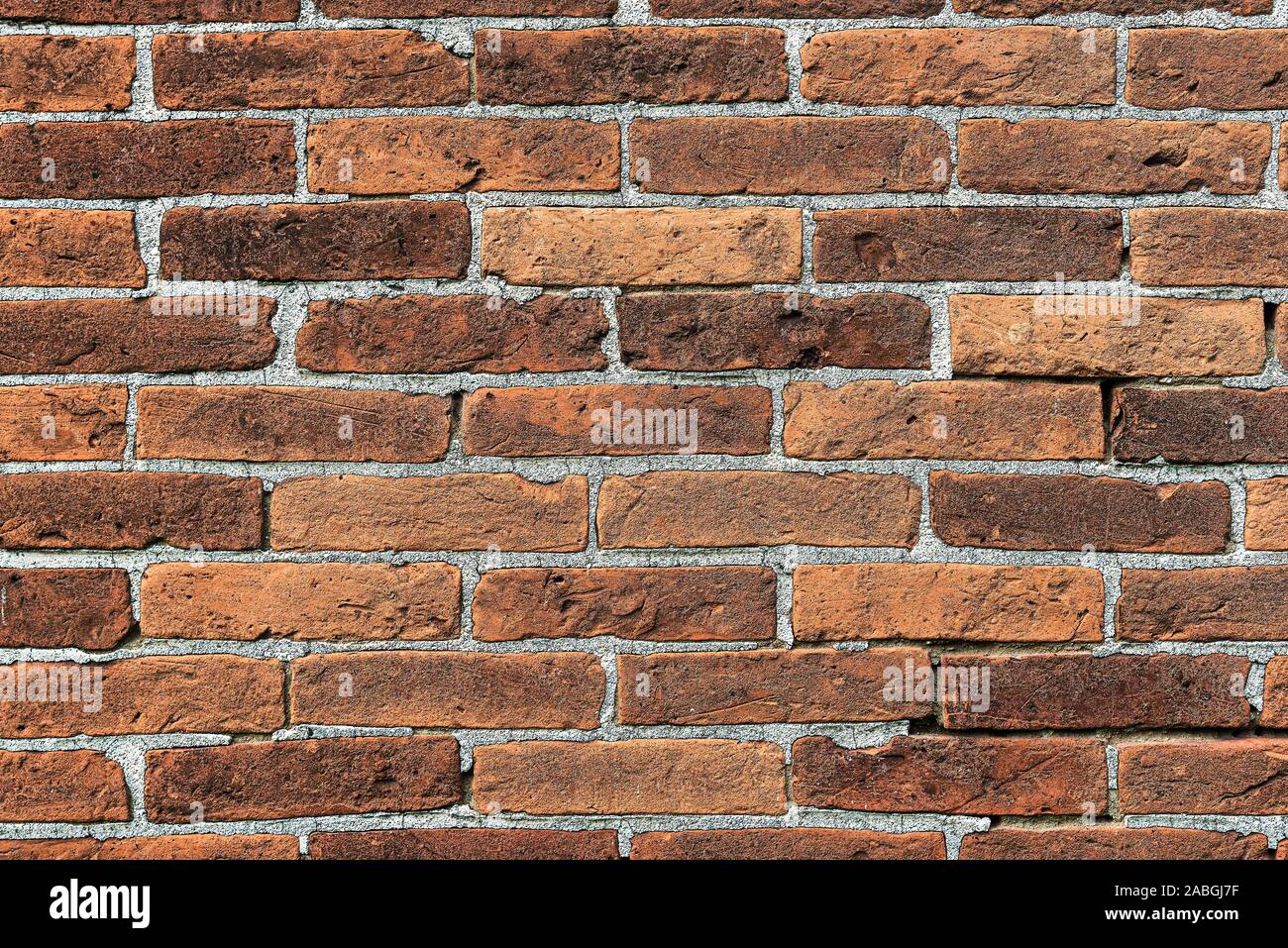 full-frame close-up of old brick stone wall background. Stock Photo