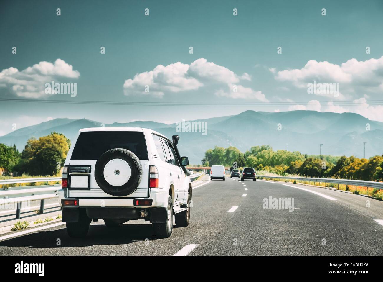 suv-car-driving-in-motorway-highway-freeway-road-with-mountains