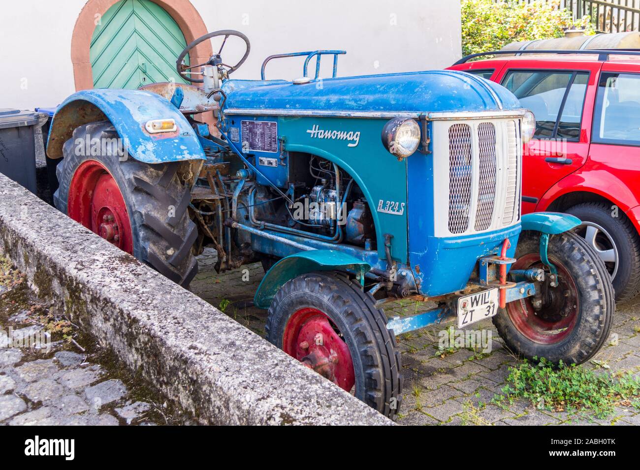 A winemaker's Hanomag R324S tractor, 1959-1962, Enkirch, Mosel valley, Rheinland-Pfalz, Germany Stock Photo