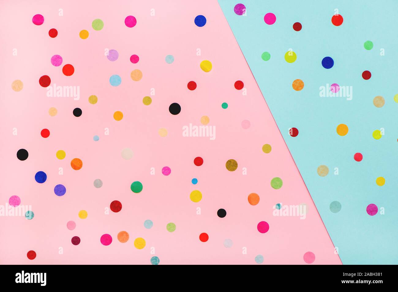 Colorful confetti on pink and blue background. Flat lay Stock Photo - Alamy