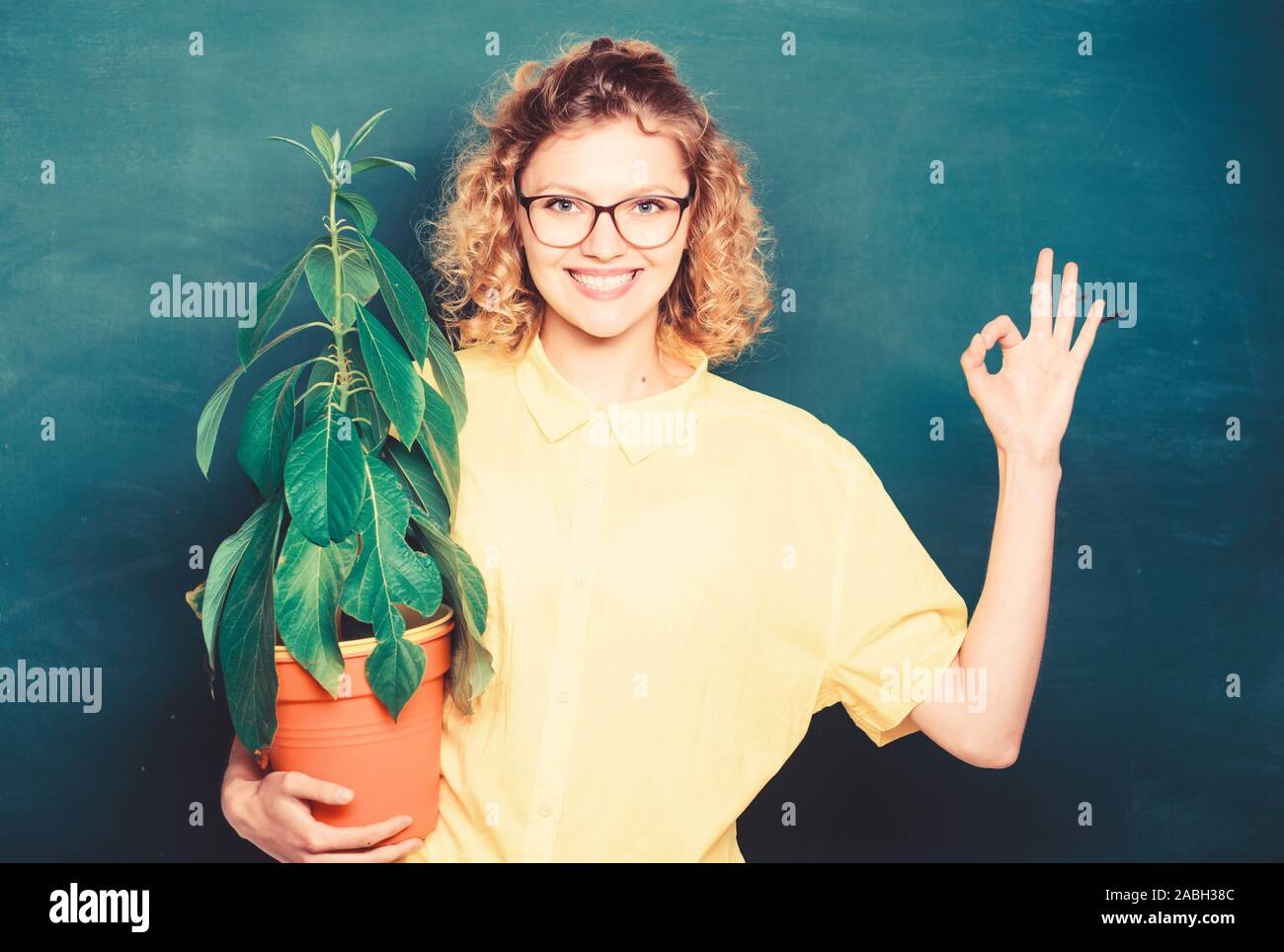 Botany education. Greenery benefits. Botany and nerd concept. Woman