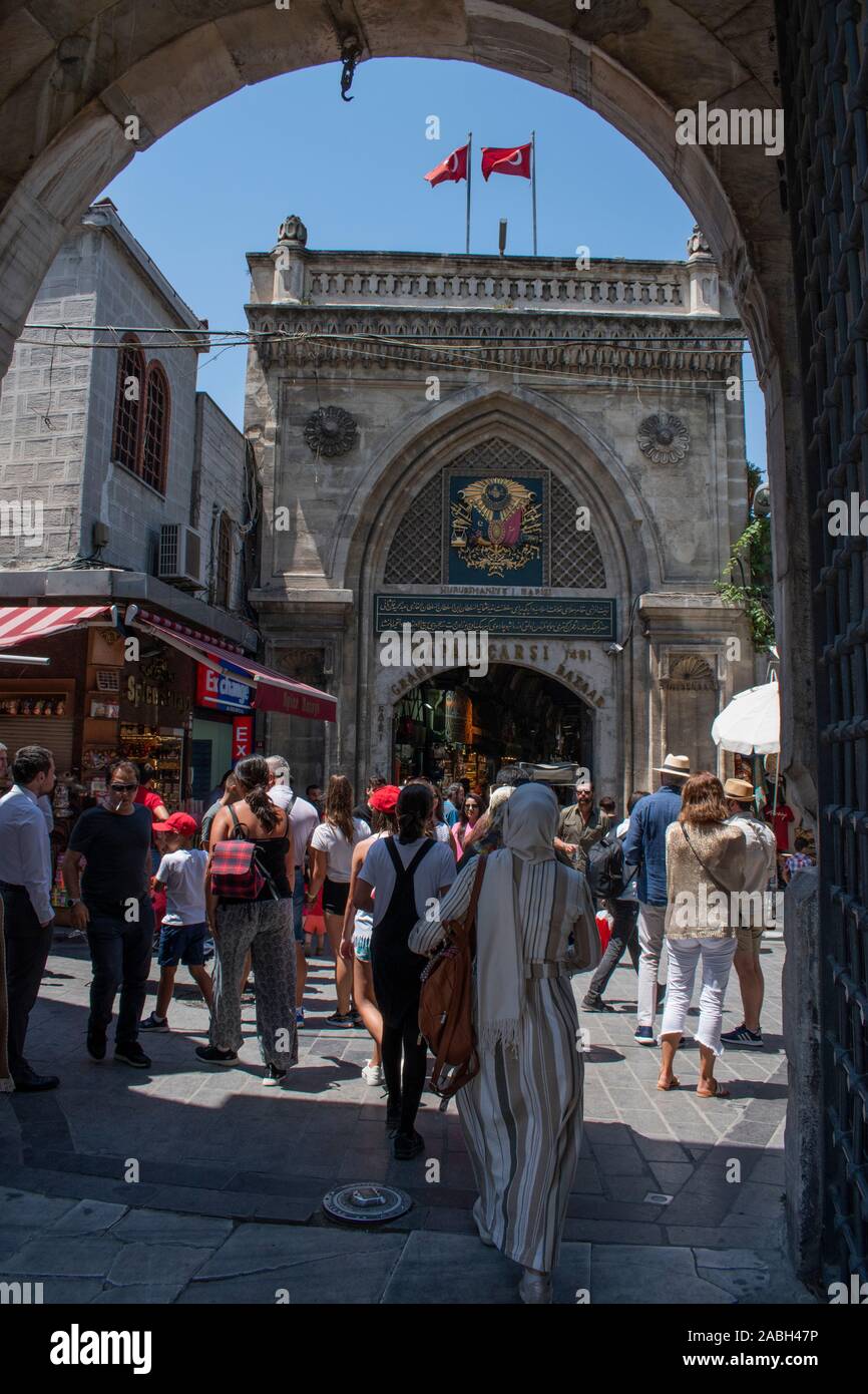 Istanbul, Turkey, Middle East: people at one of the gates of Grand Bazaar, one of the largest and oldest covered markets in the world Stock Photo