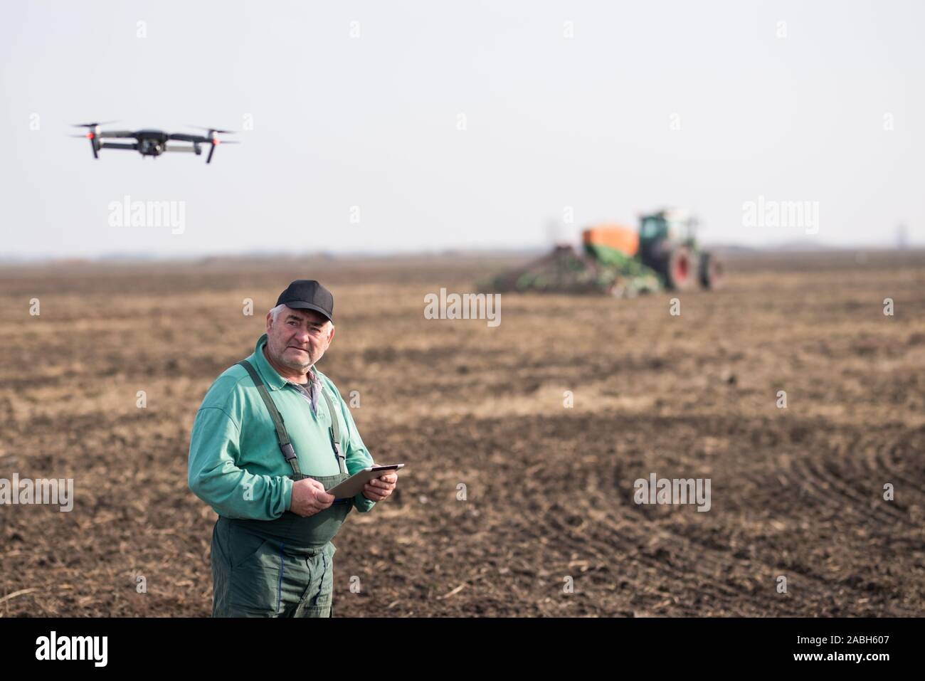Farmer with tablet in field Stock Photo