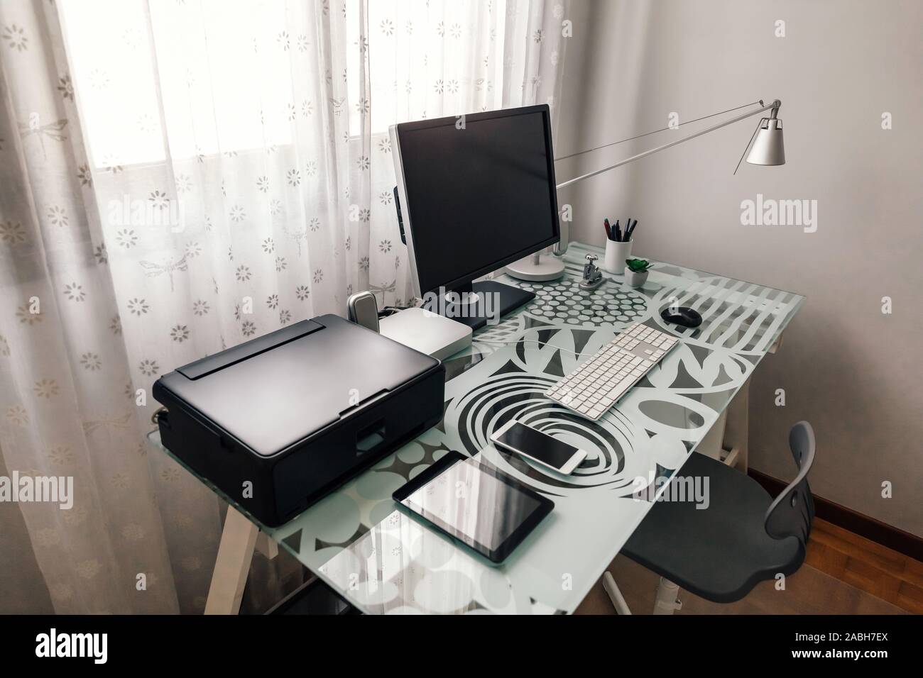Workstation with table, chair, computer and printer Stock Photo - Alamy