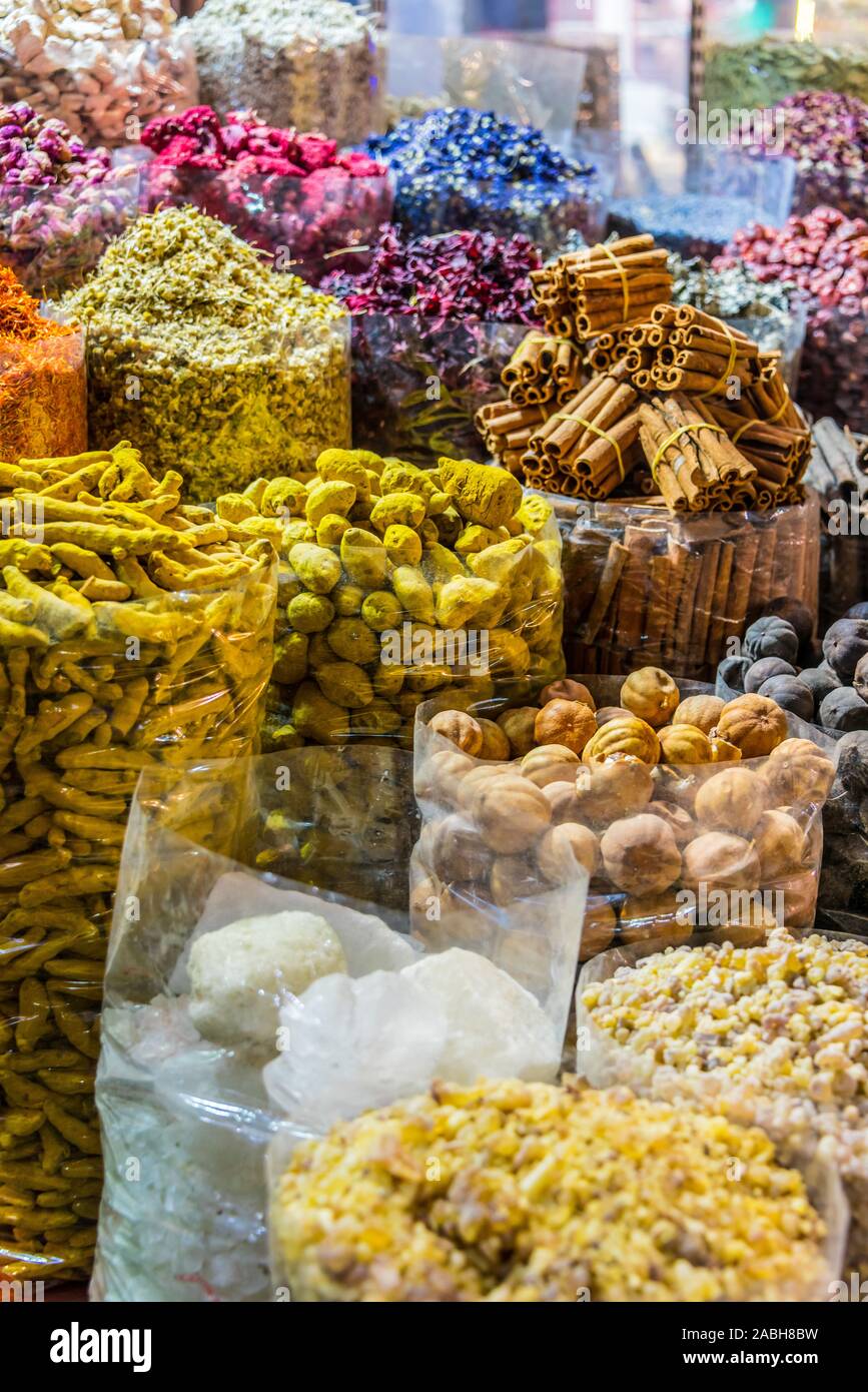 Variety of spices and herbs on the arab street market stall. Dubai Spice Souk, United Arab Emirates. Stock Photo