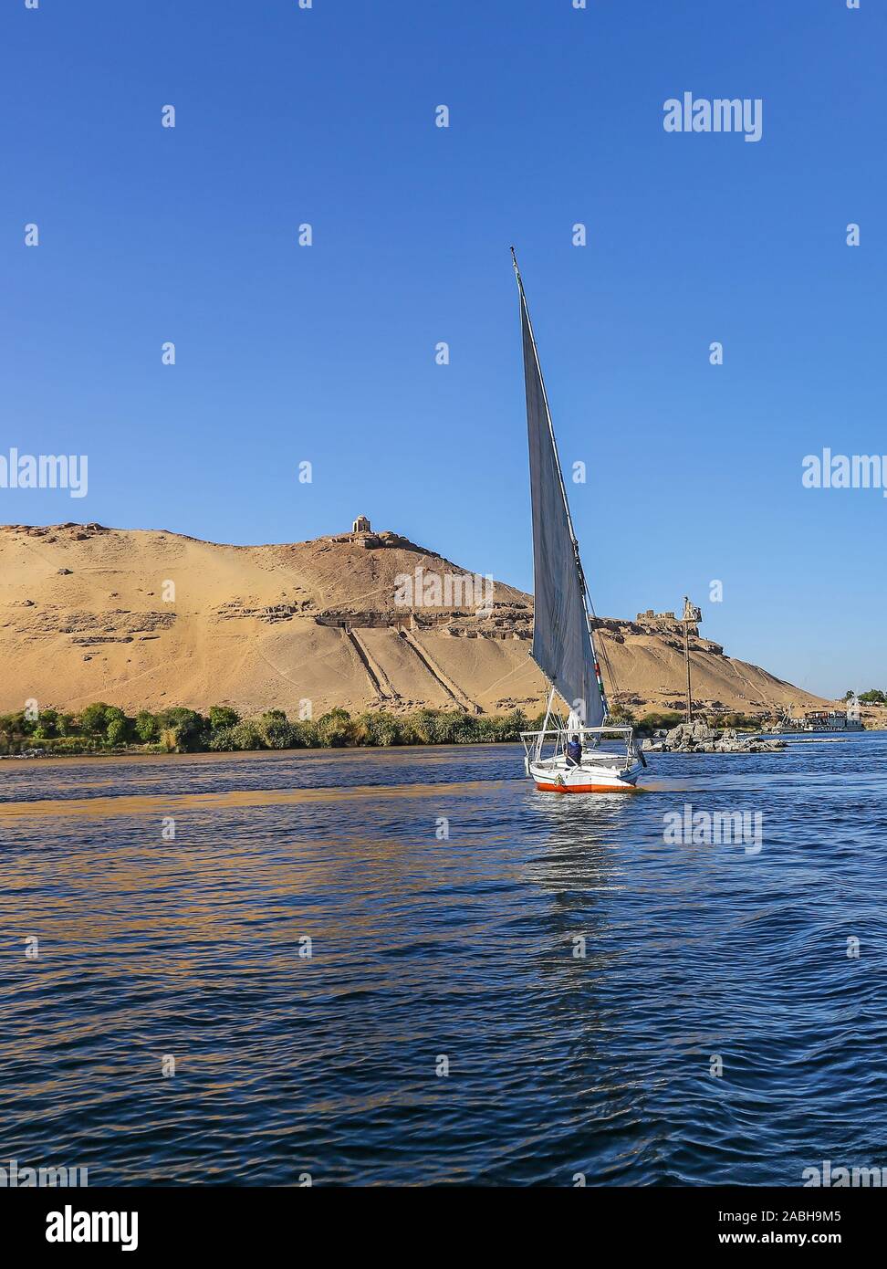 A Felucca, a traditional wooden sailing boat on the River Nile, Aswan, Egypt, Africa Stock Photo